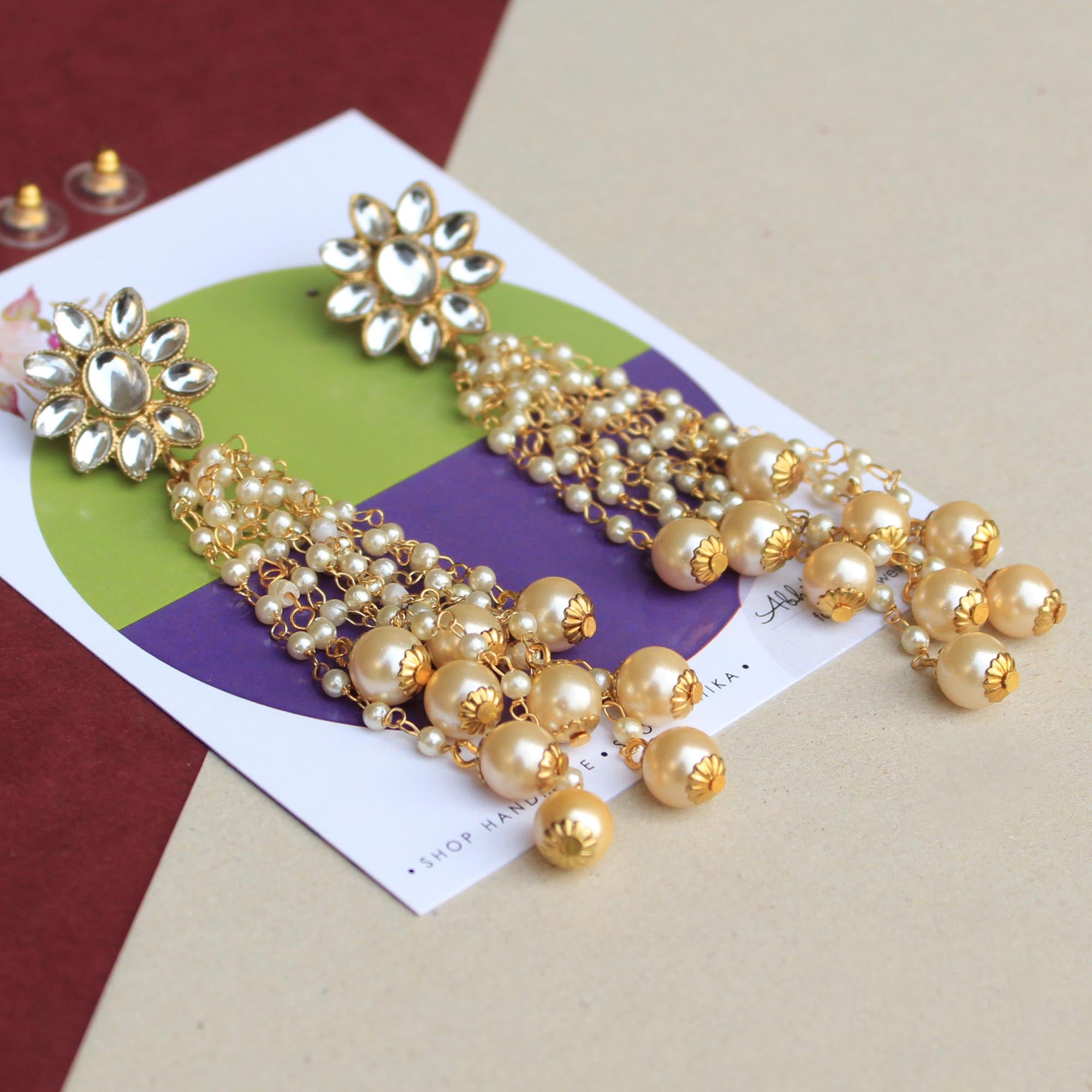 Traditional Kundan earrings in gold-tone, perfect for weddings and festive wear