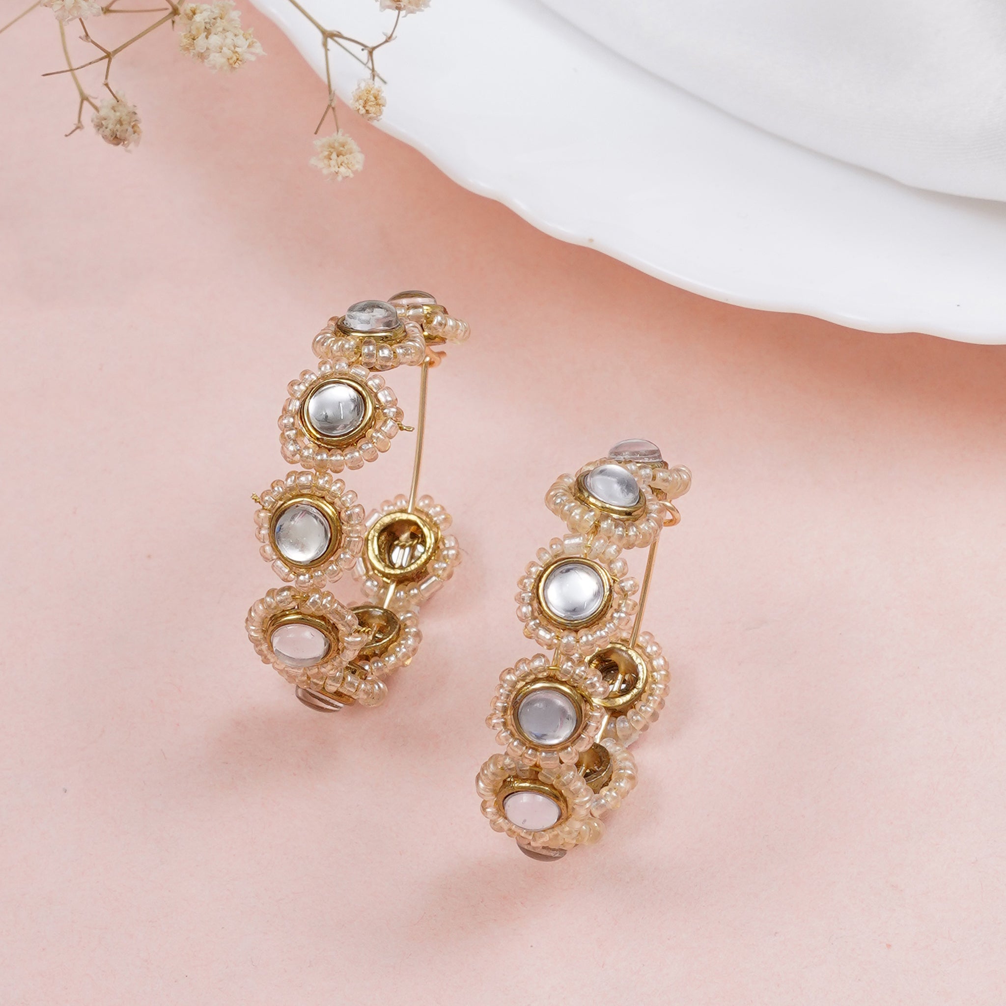 Traditional Kundan earrings in gold-tone, perfect for weddings and festive wear