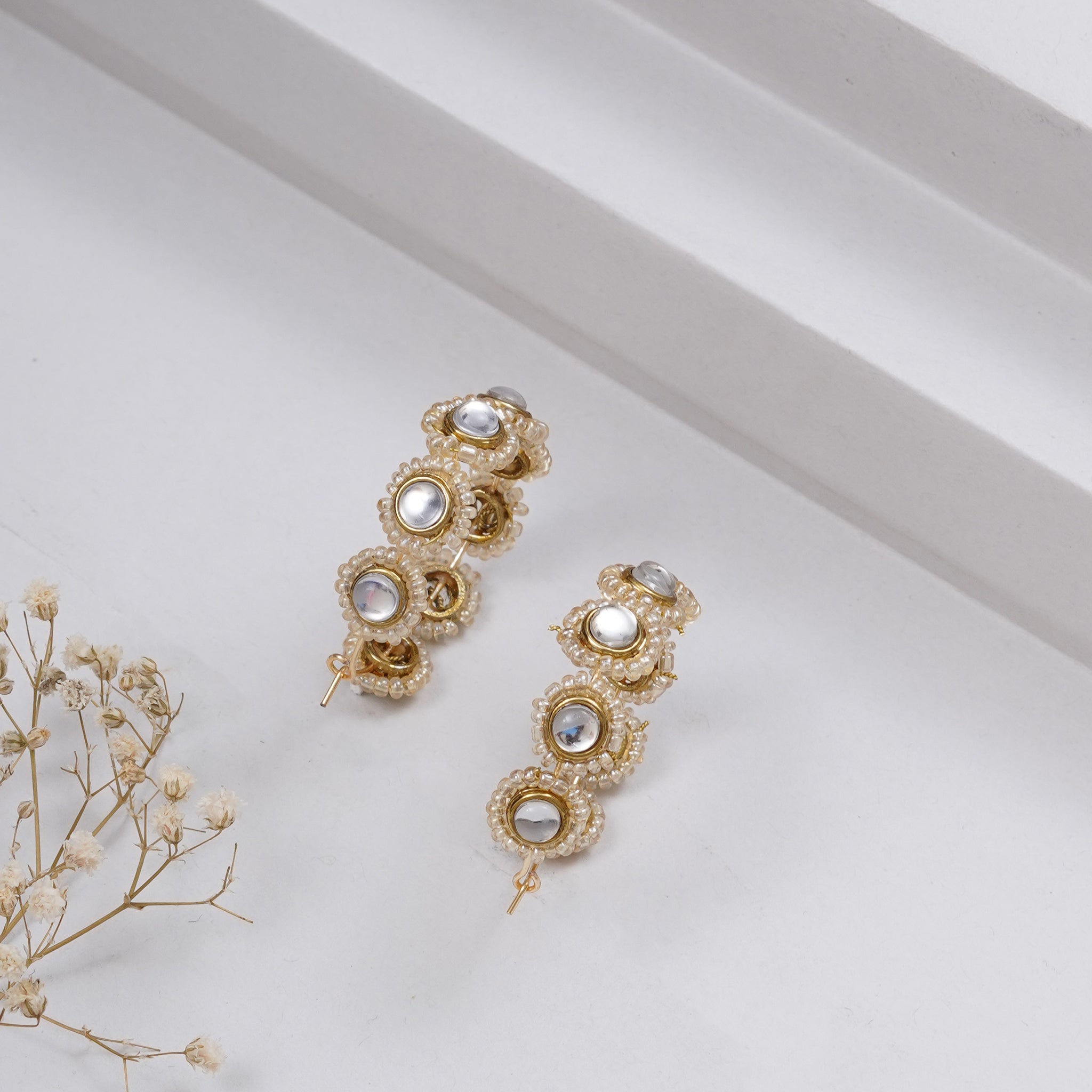 Traditional Kundan earrings in gold-tone, perfect for weddings and festive wear