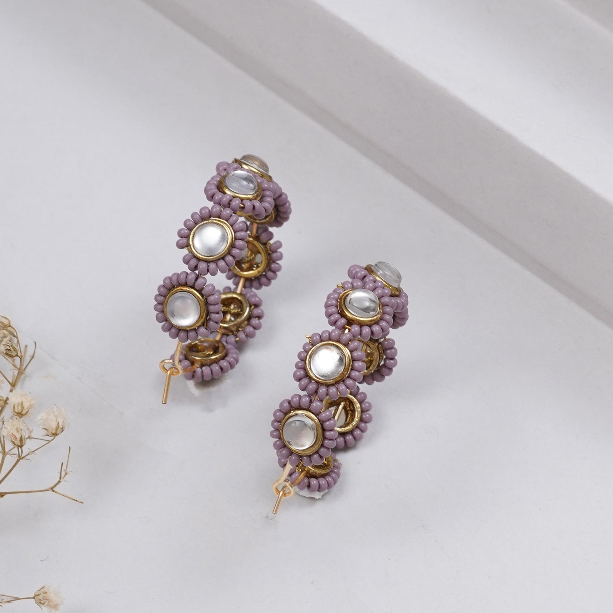 Traditional Kundan earrings in gold-tone, perfect for weddings and festive wear