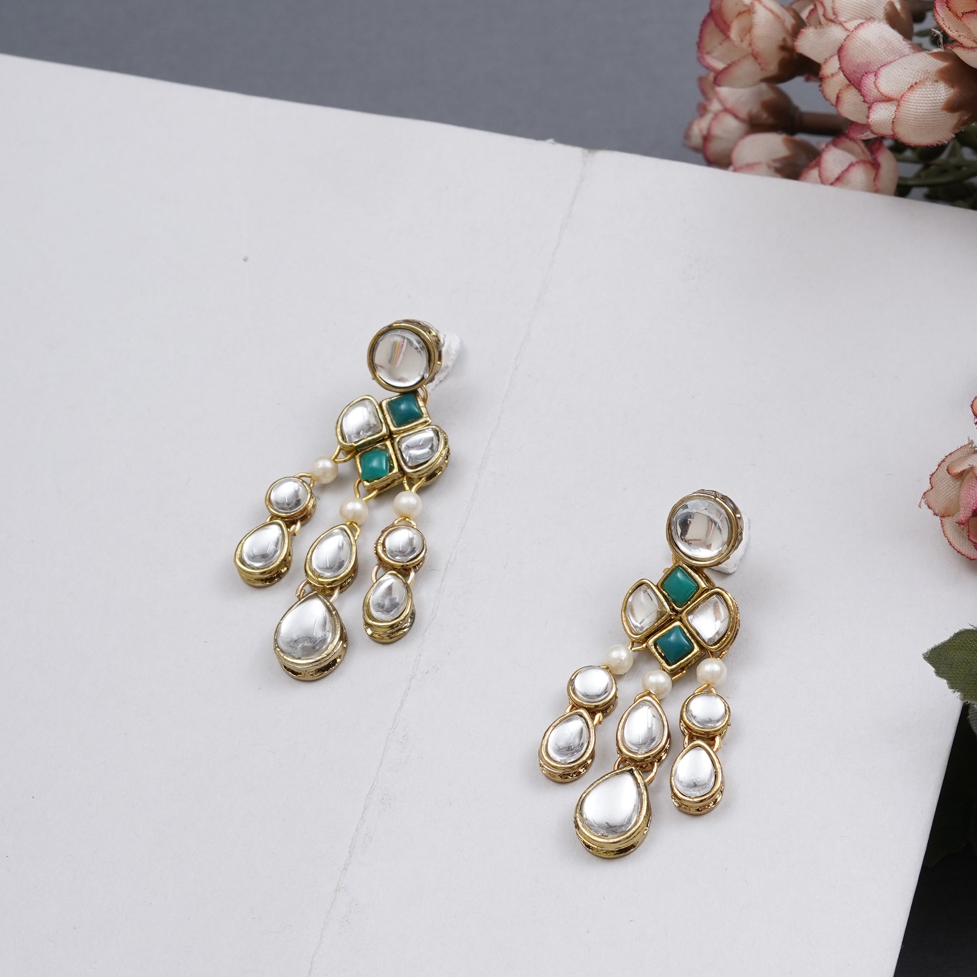 Traditional Kundan earrings in gold-tone, perfect for weddings and festive wear