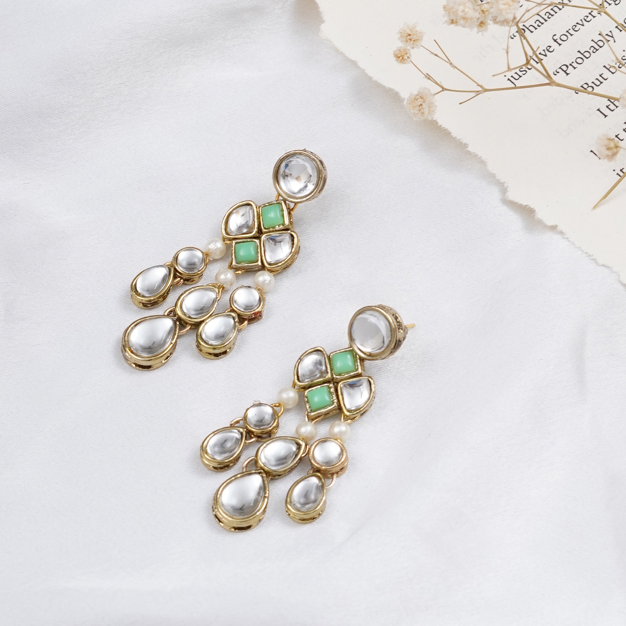 Traditional Kundan earrings in gold-tone, perfect for weddings and festive wear