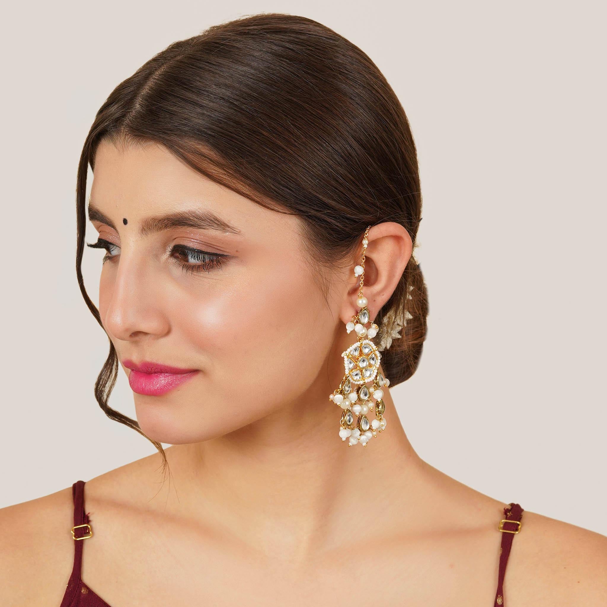 Traditional Kundan earrings in gold-tone, perfect for weddings and festive wear