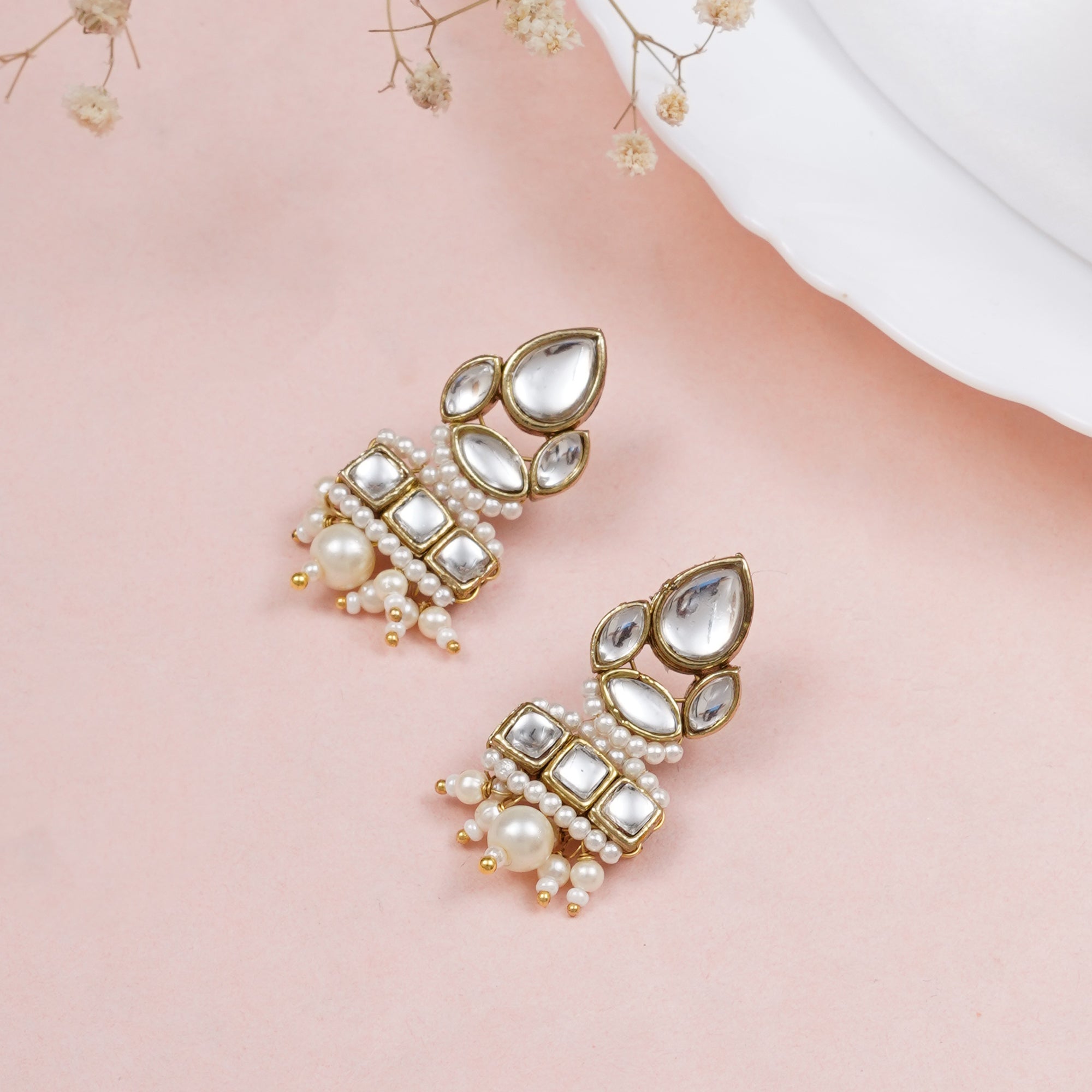 Traditional Kundan earrings in gold-tone, perfect for weddings and festive wear