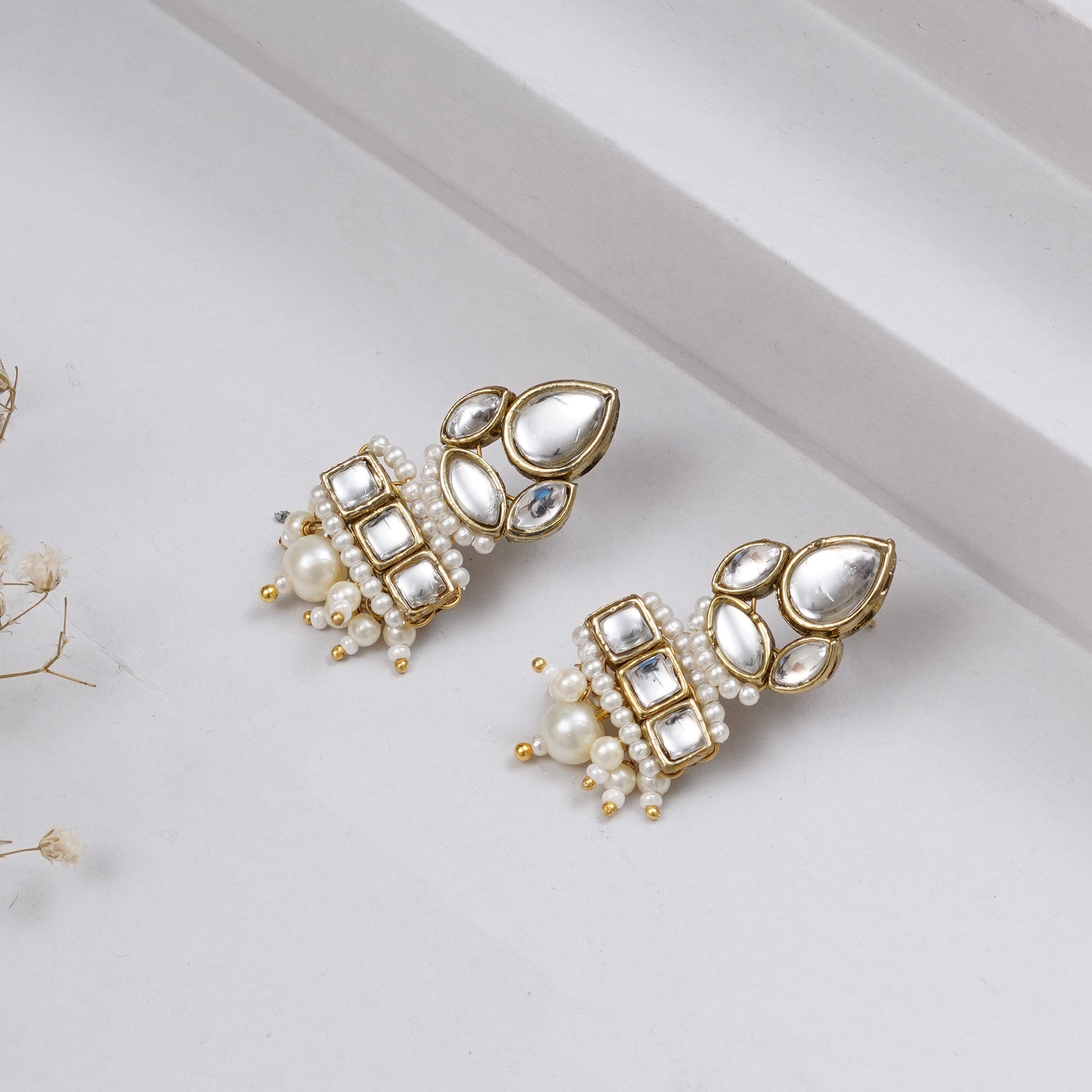 Traditional Kundan earrings in gold-tone, perfect for weddings and festive wear