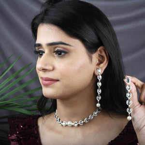 Traditional Kundan earrings in gold-tone, perfect for weddings and festive wear