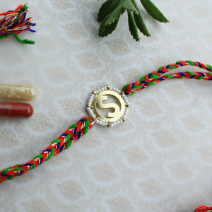 BeAbhika White Beads Gold Tone Customised Initial Name Initial Letter Rakhi Designer Unqiue Famous Rakhi Lightweight Easy To Tie Rakhi Available At Best Price In India Online COD Available Send Rakhi To Brother Small Brother Big Brother Younger Brother Send Rakhi Abroad With Roli Chawal Capsules