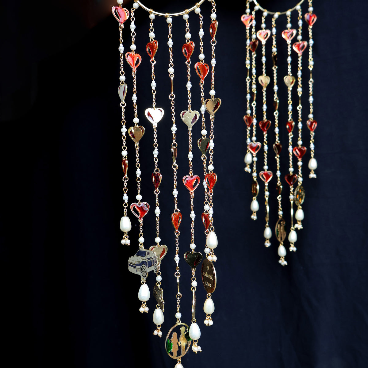 Romantic pearl Kaleere with red resin hearts charms, gold detailing and playful personalised charms  from the Darpan kalire collection by BeAbhika
