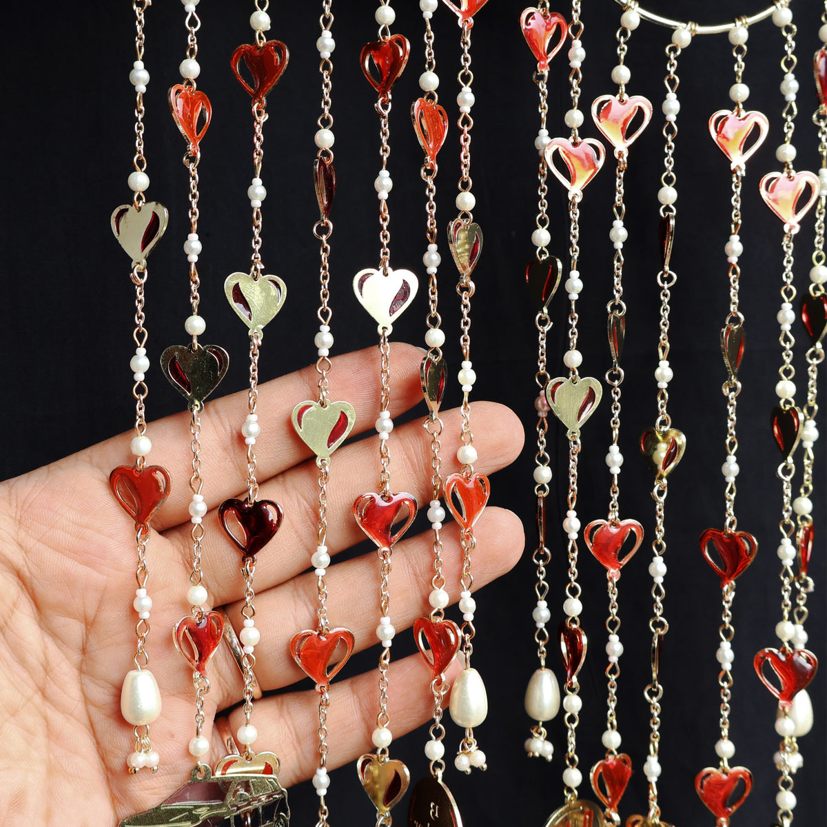Romantic pearl Kaleere with red resin hearts charms, gold detailing and playful personalised charms  from the Darpan kalire collection by BeAbhika