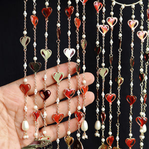Romantic pearl Kaleere with red resin hearts charms, gold detailing and playful personalised charms  from the Darpan kalire collection by BeAbhika