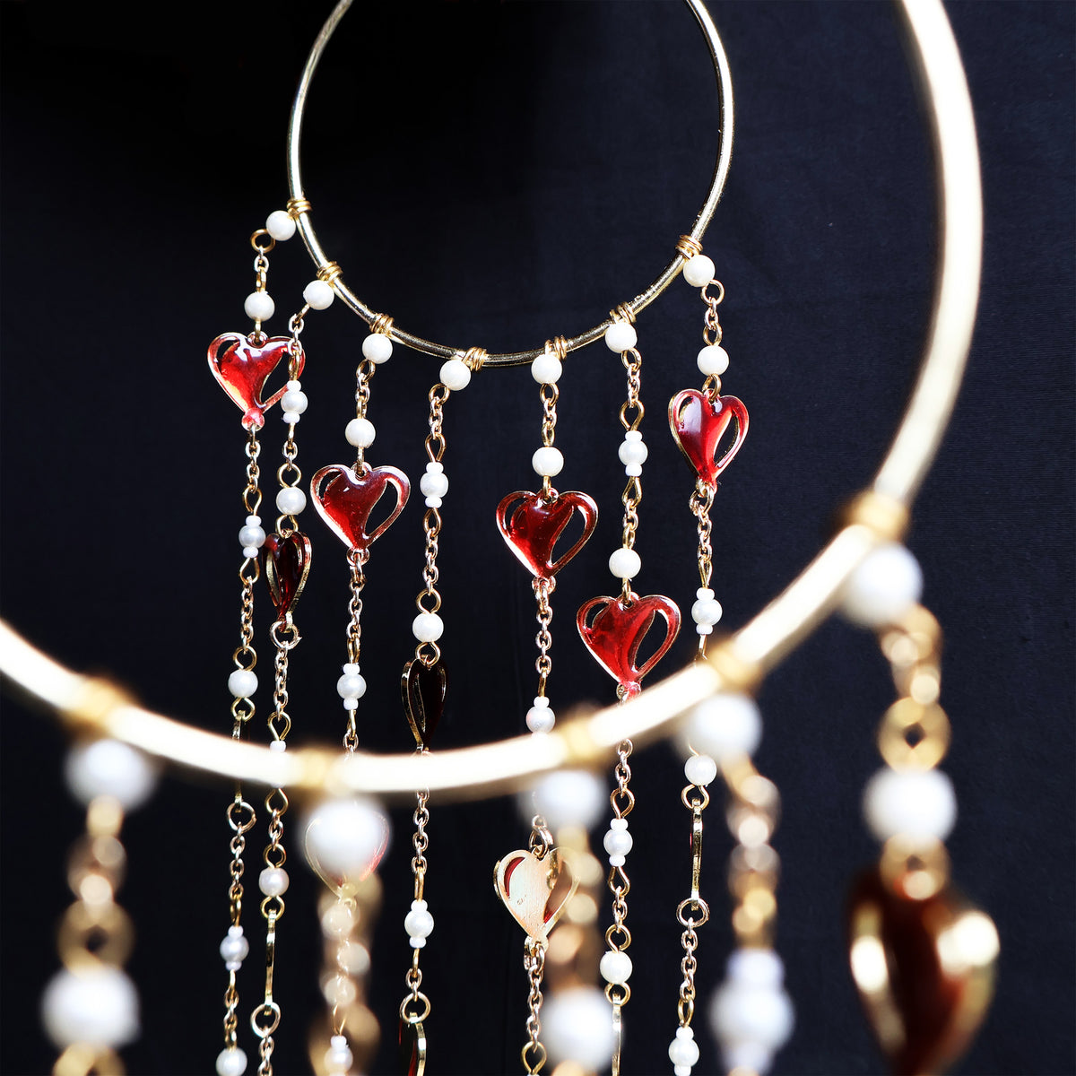 Romantic pearl Kaleere with red resin hearts charms, gold detailing and playful personalised charms  from the Darpan kalire collection by BeAbhika