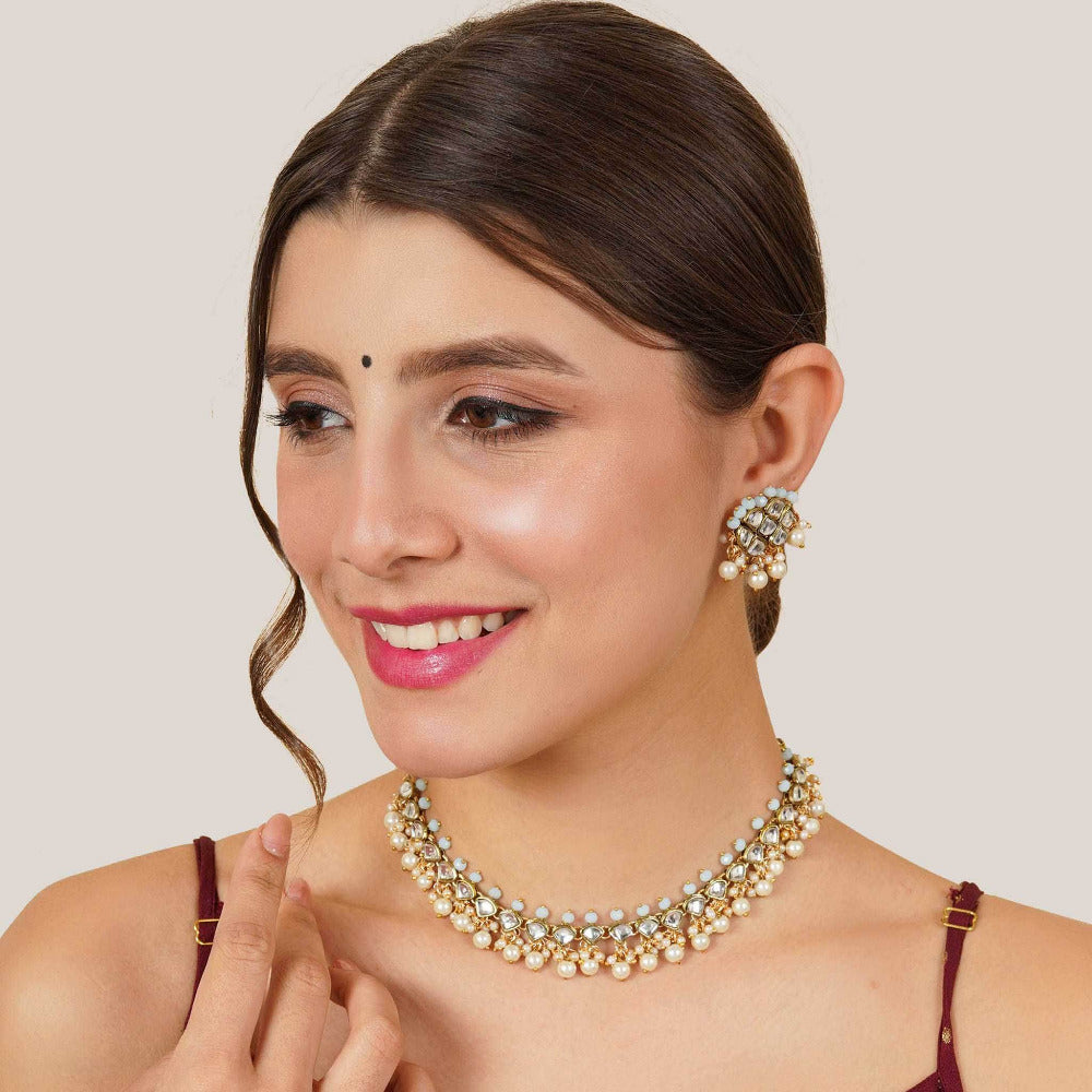 Kundan choker set in gold-tone with matching earrings and long bridal necklace, perfect for wedding functions , festive and bridal wear