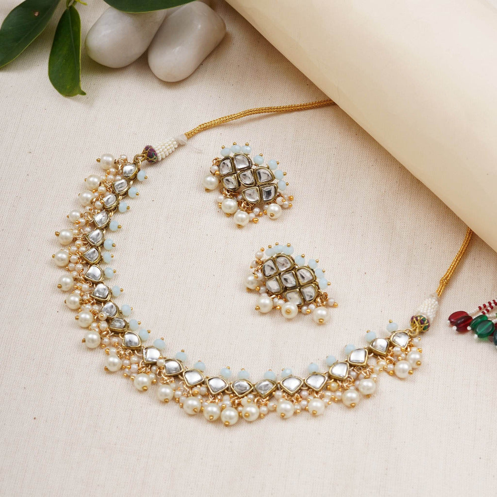 Kundan choker set in gold-tone with matching earrings and long bridal necklace, perfect for wedding functions , festive and bridal wear