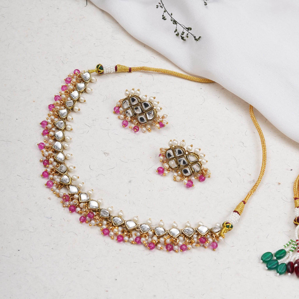 Kundan choker set in gold-tone with matching earrings and long bridal necklace, perfect for wedding functions , festive and bridal wear