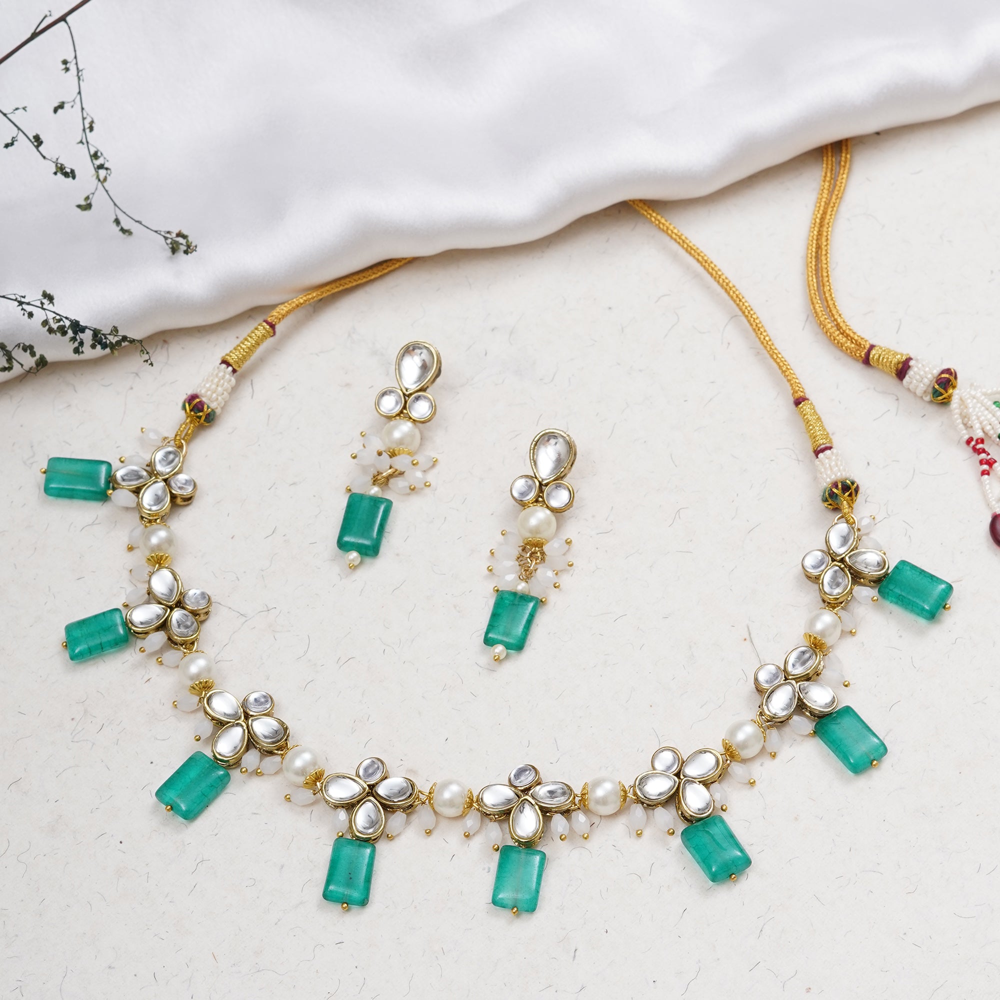 Kundan choker set in gold-tone with matching earrings and long bridal necklace, perfect for wedding functions , festive and bridal wear