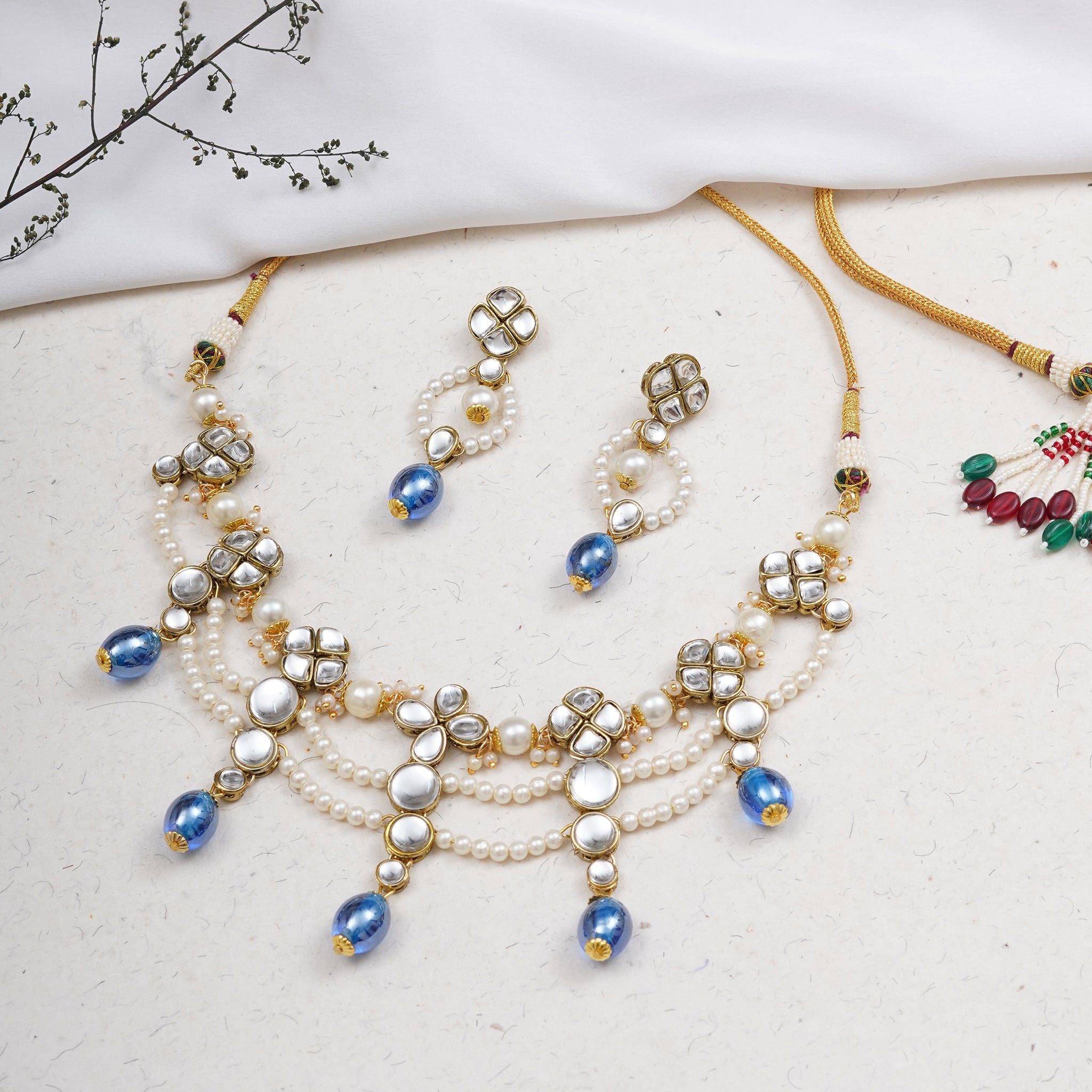 Kundan choker set in gold-tone with matching earrings and long bridal necklace, perfect for wedding functions , festive and bridal wear