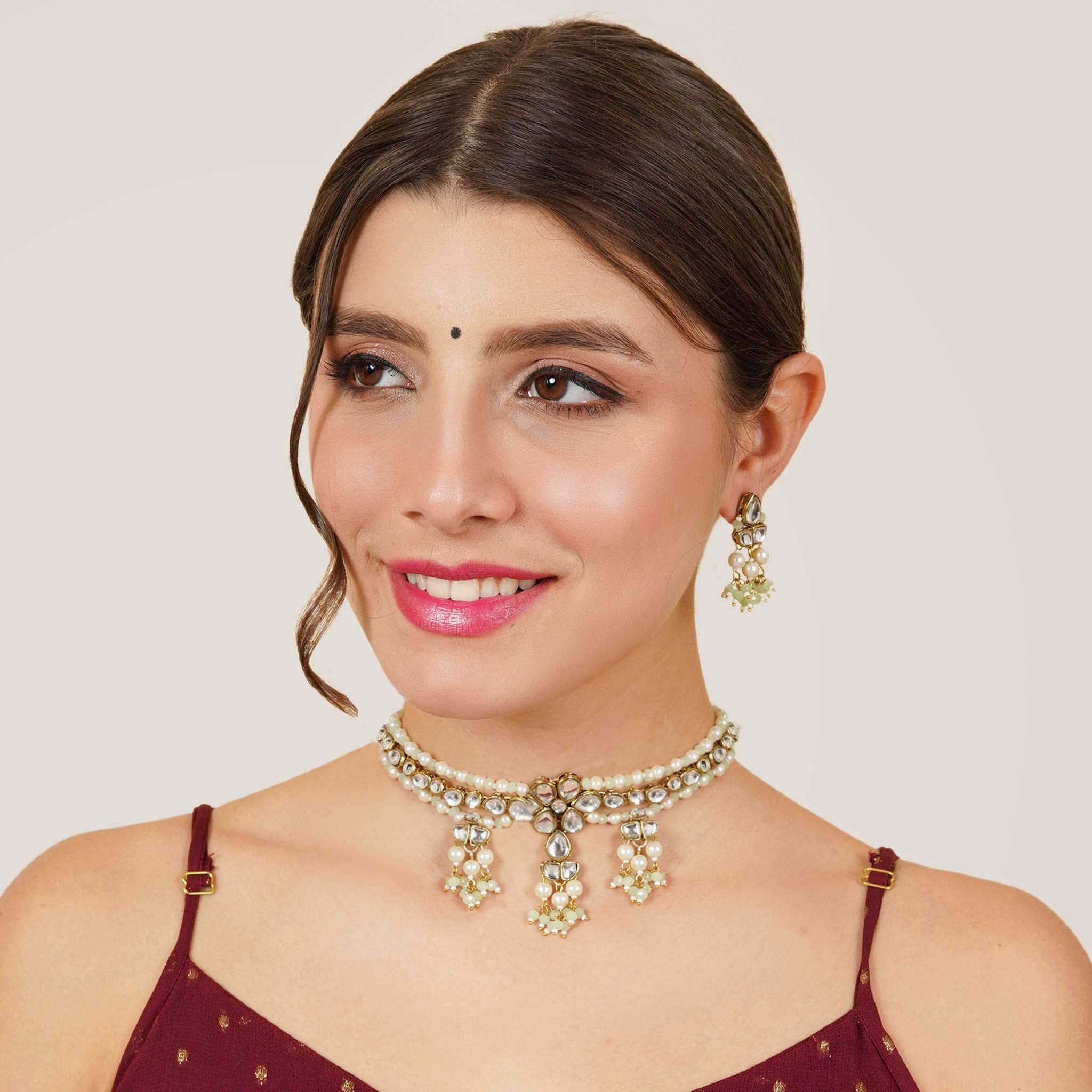 Kundan choker set in gold-tone with matching earrings and long bridal necklace, perfect for wedding functions , festive and bridal wear