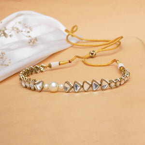 Kundan choker set in gold-tone with matching earrings and long bridal necklace, perfect for wedding functions , festive and bridal wear