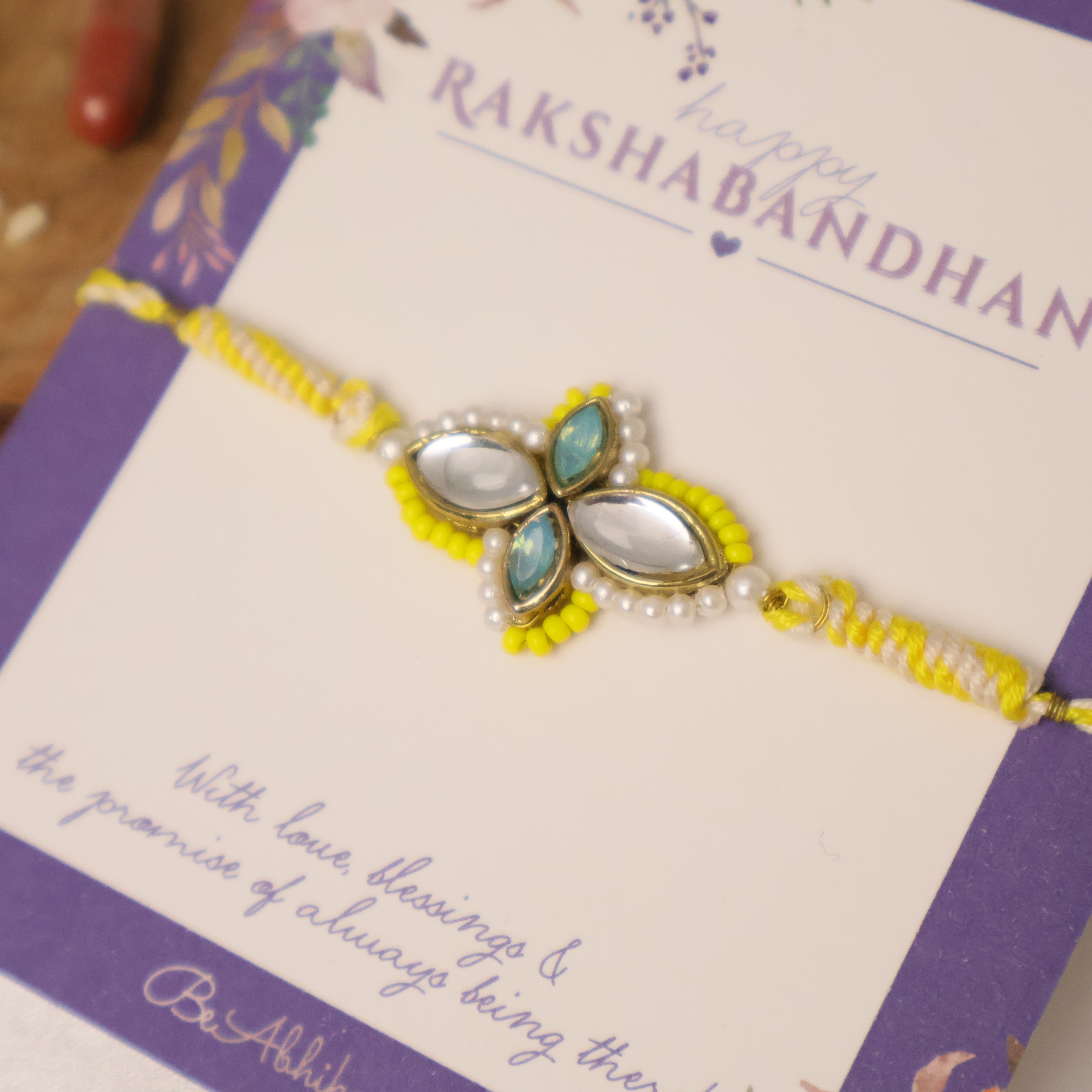 Yellow Kundan Floral Pearl Rakhi