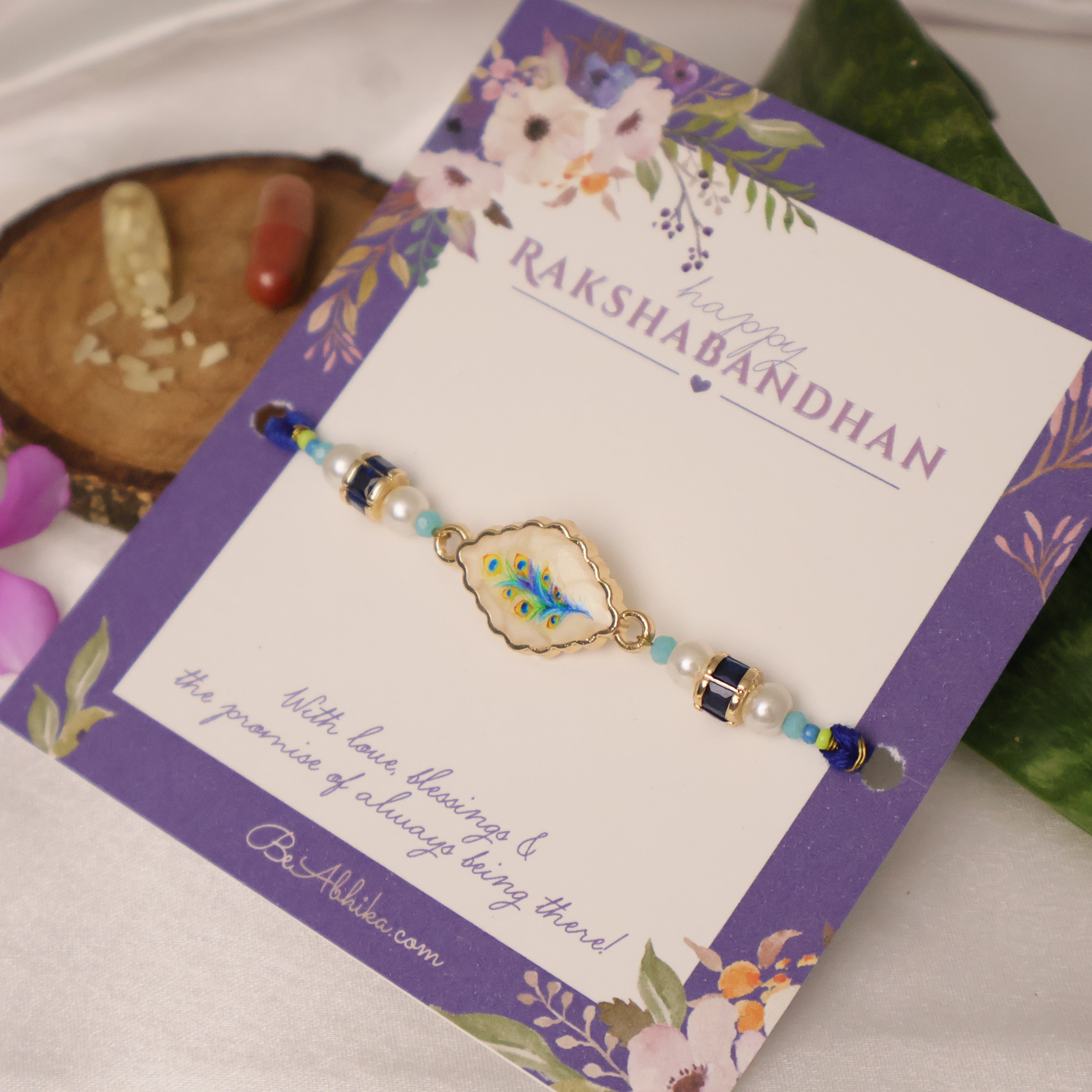 Blue Peacock Pearl Charm Rakhi