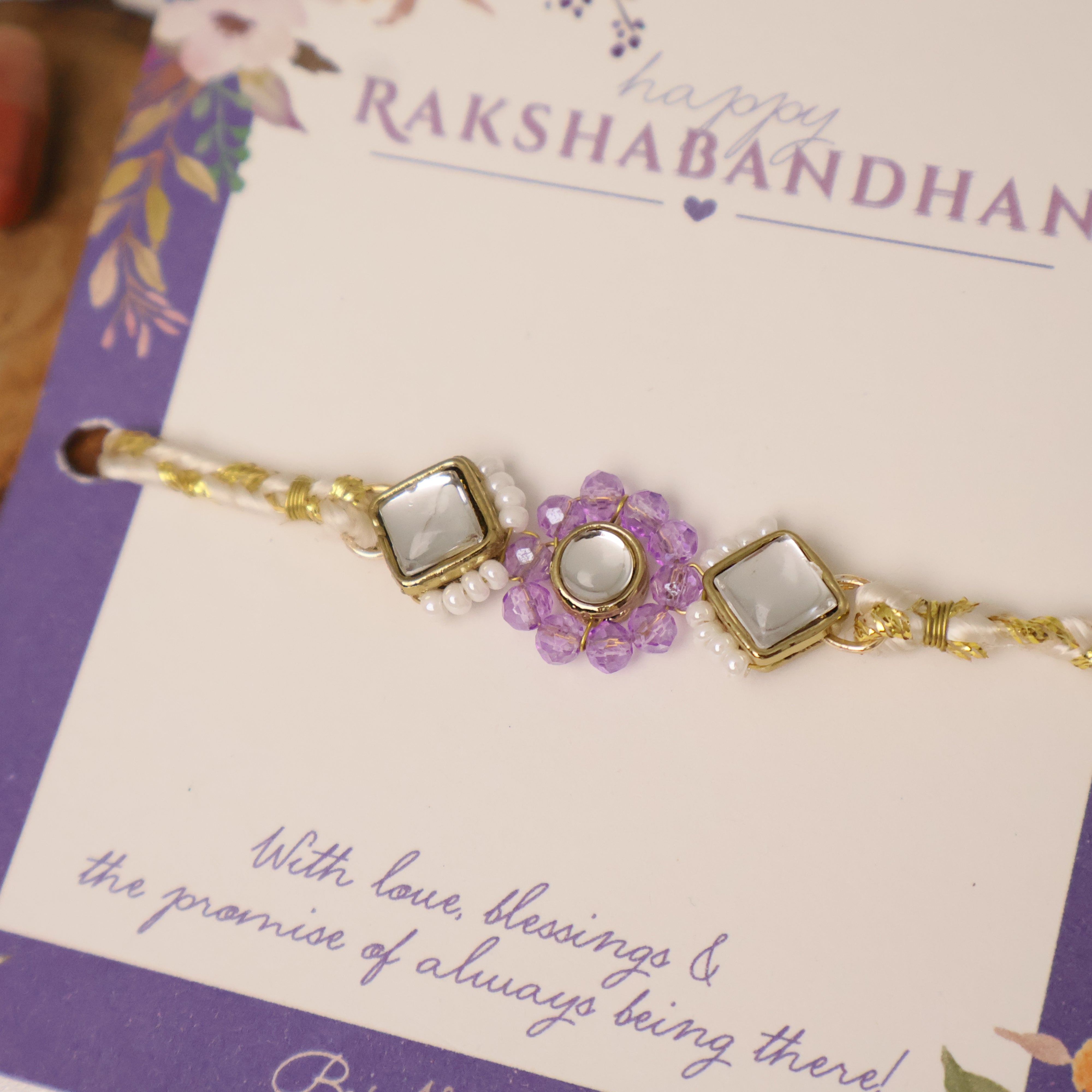 Purple Floral Pearl Stone Rakhi