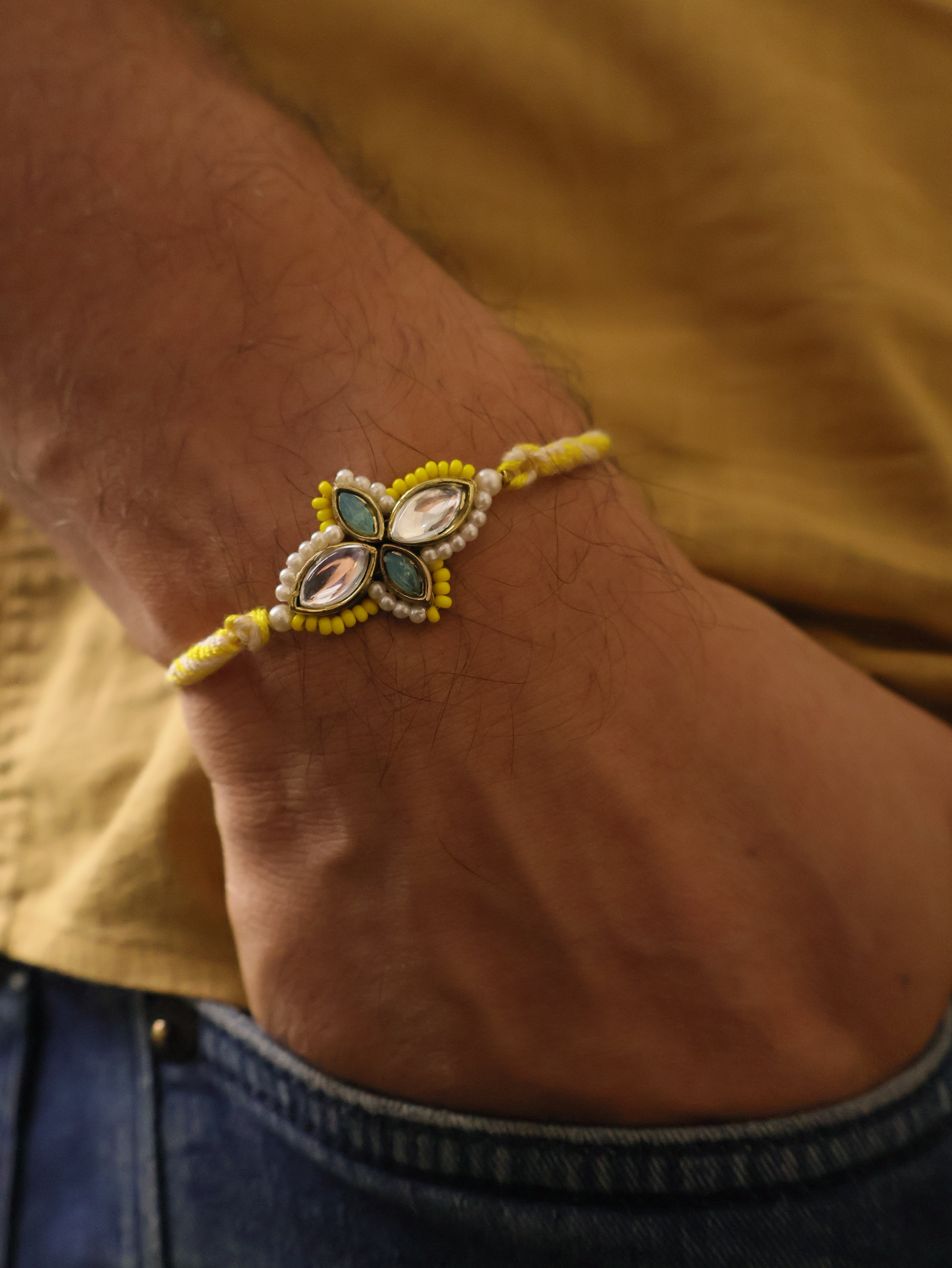 Yellow Kundan Floral Pearl Rakhi