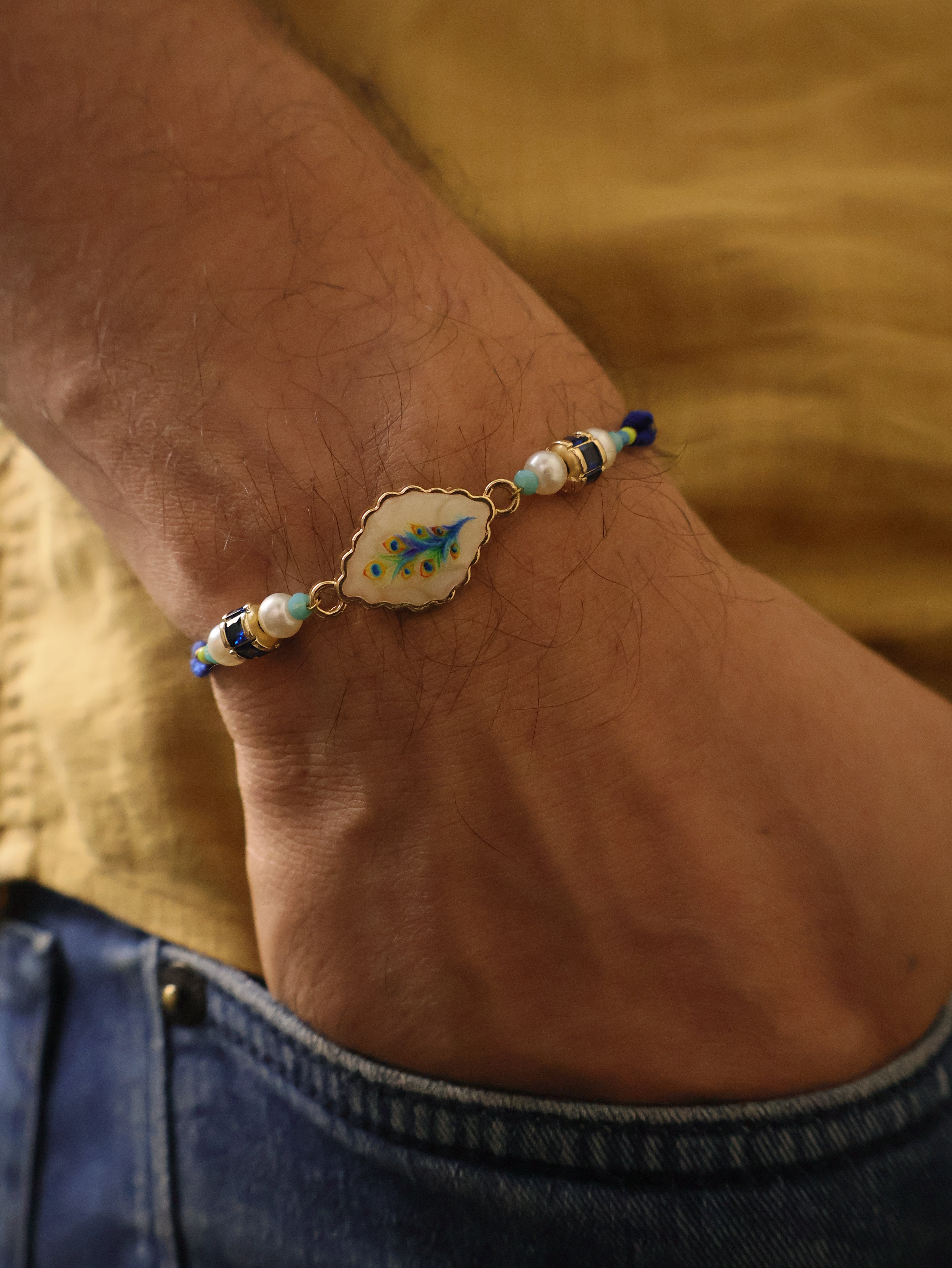 Blue Peacock Pearl Charm Rakhi