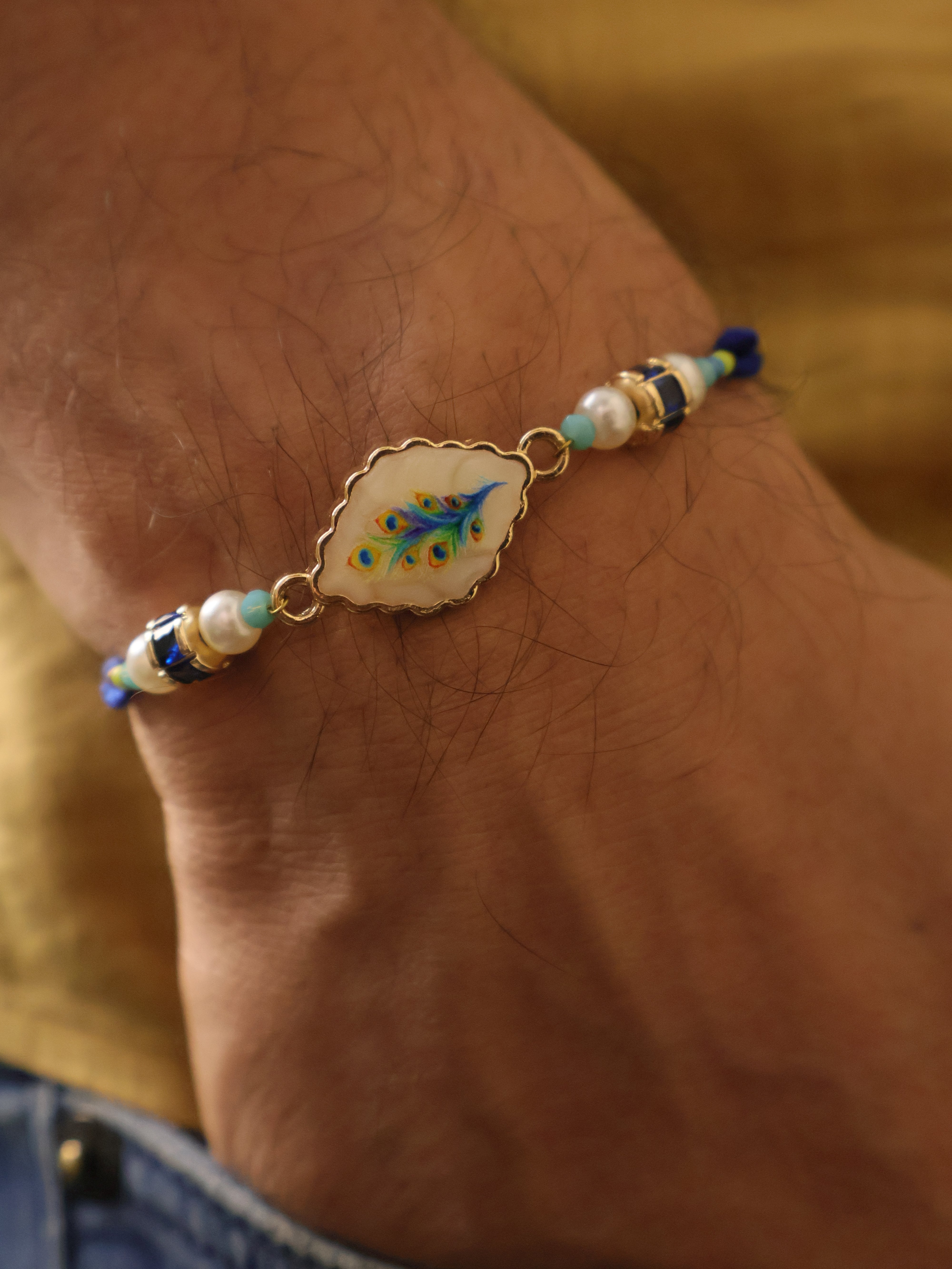 Blue Peacock Pearl Charm Rakhi