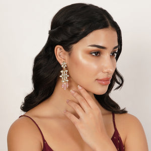 Floral Kundan earrings with pink drops, featuring marquise-cut glass stones, faux pearls and gold-tone mixed alloy.