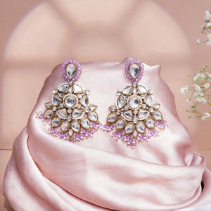 Floral Kundan earrings with purple drops, featuring pear-cut glass Kundan stones, faux pearls and gold-tone mixed alloy.
