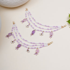 Floral Kundan hairchain with purple drops, featuring faceted purple glass beads, faux pearls and gold-tone mixed alloy.