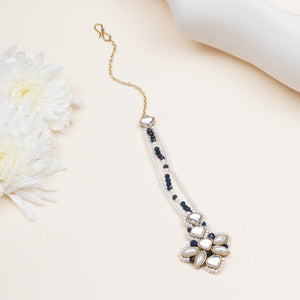 Pearl-Strand Maangtikka with Floral Details, featuring navy blue glass beads, white faux pearls and gold-tone mixed alloy.