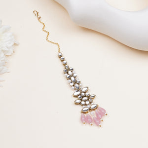 Floral Kundan maangtikka with pink drops, featuring marquise-cut glass stones, white faux pearls and gold-tone mixed alloy.