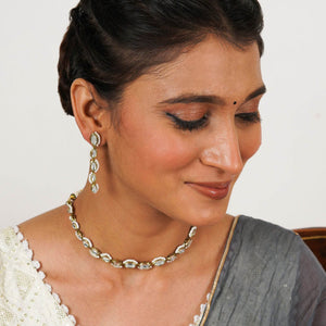 Kundan choker set in gold-tone with matching earrings and long bridal necklace, perfect for wedding functions , festive and bridal wear