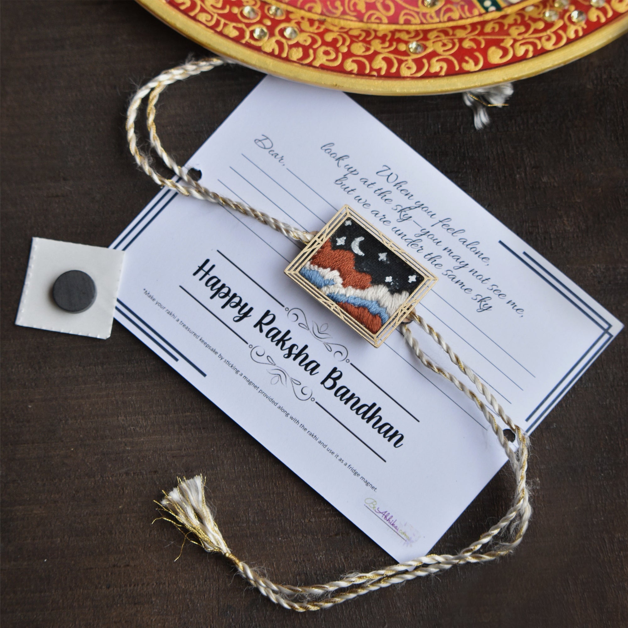 BeAbhika Hand Embroidered Star Gazing Astronaut Bro Moon Rakhi With Fridge Magnet Designer Unqiue Famous Rakhi Lightweight Easy To Tie Rakhi Available At Best Price In India Online COD Available Send Rakhi To Brother Small Brother Big Brother Younger Brother Send Rakhi Abroad With Roli Chawal Capsules