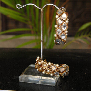 Traditional Kundan earrings in gold-tone, perfect for weddings and festive wear