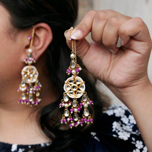 Traditional Kundan earrings in gold-tone, perfect for weddings and festive wear