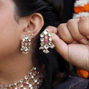 Traditional Kundan earrings in gold-tone, perfect for weddings and festive wear