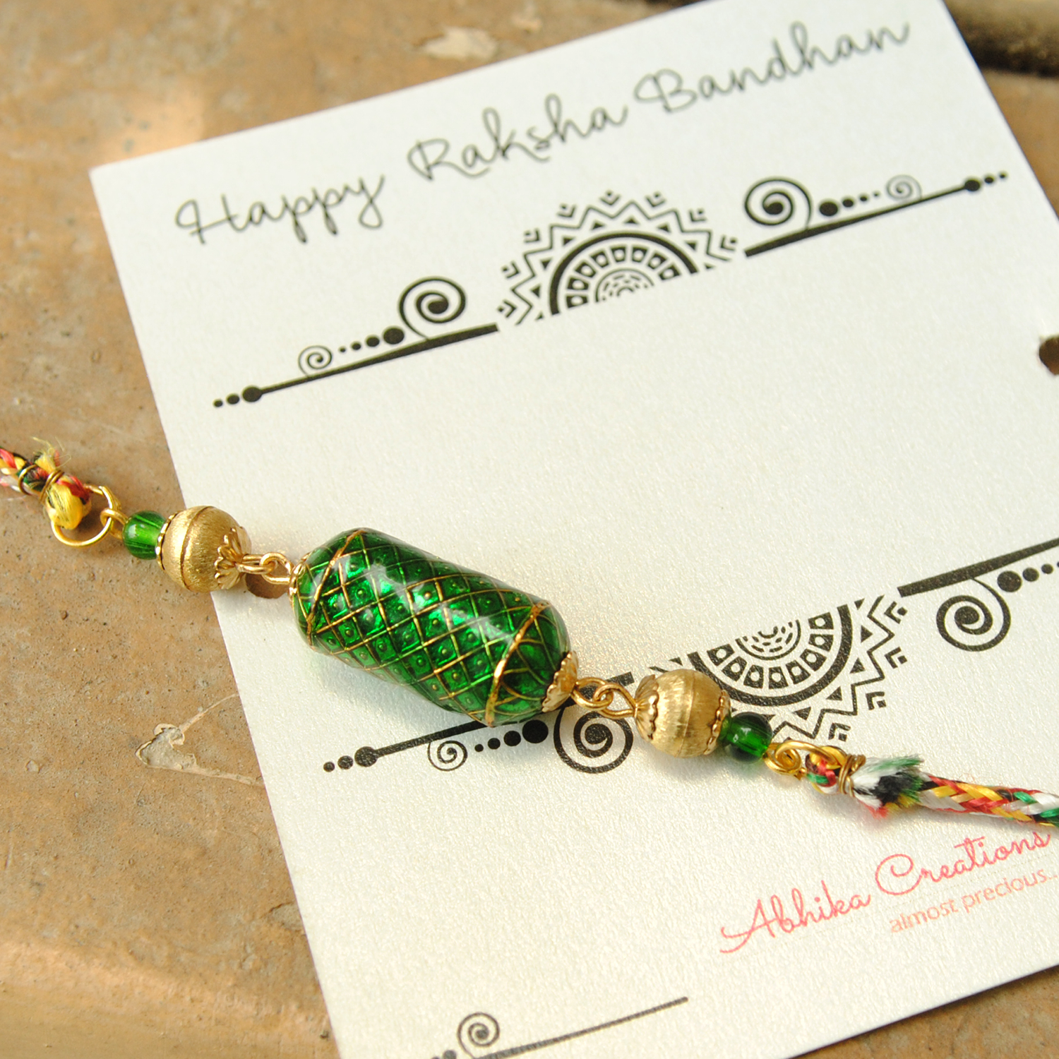 Enamel Damroo Rakhi