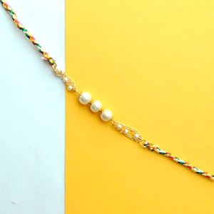 BeAbhika White Pearl Rakhi Gold Tone Lightweight Easy To Tie Rakhi Available At Best Price In India Online COD Available Send Rakhi To Brother For Small Brother Big Brother Younger Brother Send Rakhi Abroad With Roli Chawal Capsules Designer Unqiue Famous 