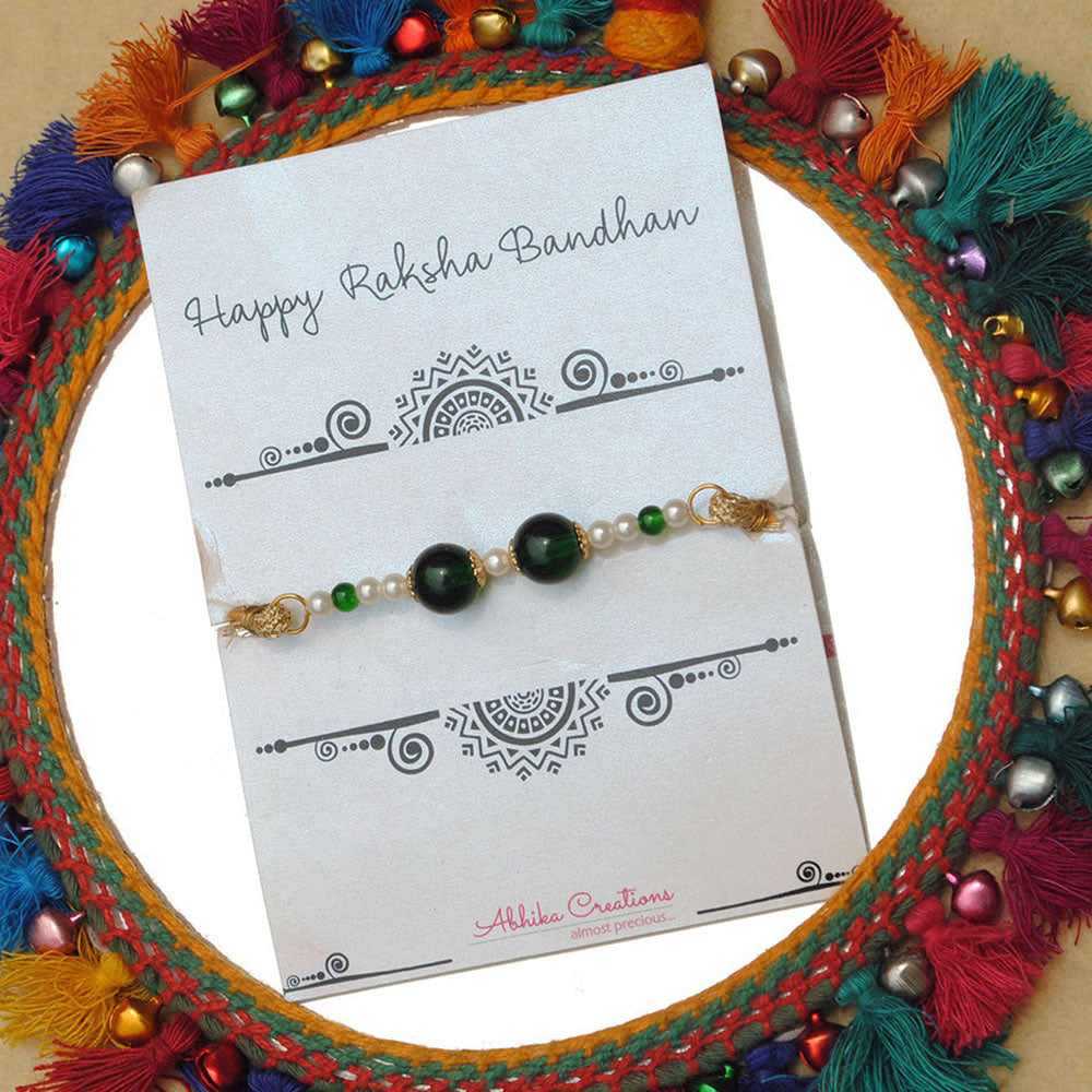 BeAbhika Green Pearl Personalised Initial Rakhi Gold Tone Lightweight Easy To Tie Customised Name Letter Rakhi Available At Best Price In India Online COD Available Send Rakhi To Brother Small Brother Big Brother Younger Brother Send Rakhi Abroad With Roli Chawal Capsules Designer Unqiue Famous 