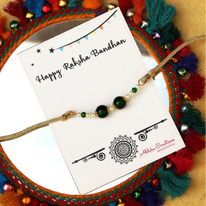 BeAbhika Green Pearl Personalised Initial Rakhi Gold Tone Lightweight Easy To Tie Customised Name Letter Rakhi Available At Best Price In India Online COD Available Send Rakhi To Brother Small Brother Big Brother Younger Brother Send Rakhi Abroad With Roli Chawal Capsules Designer Unqiue Famous 