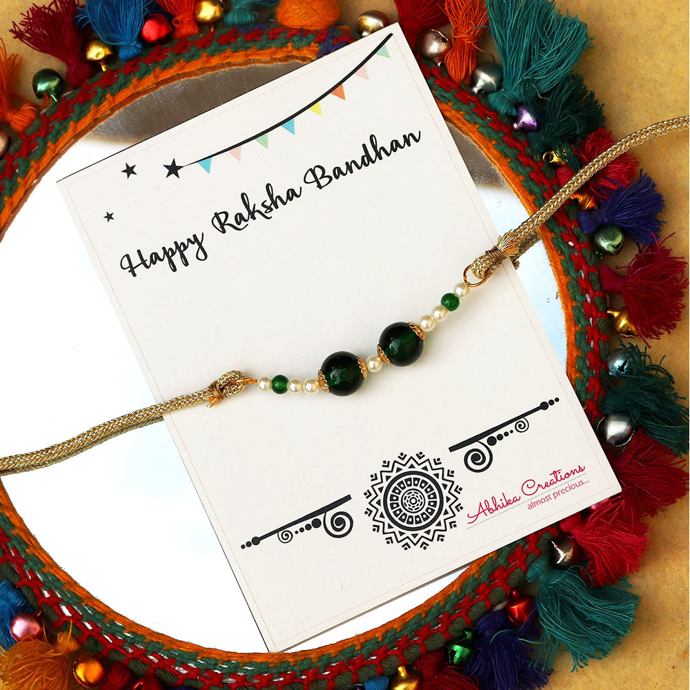 BeAbhika Green Pearl Personalised Initial Rakhi Gold Tone Lightweight Easy To Tie Customised Name Letter Rakhi Available At Best Price In India Online COD Available Send Rakhi To Brother Small Brother Big Brother Younger Brother Send Rakhi Abroad With Roli Chawal Capsules Designer Unqiue Famous 
