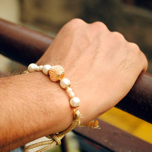 BeAbhika White Pearl Rakhi Gold Tone Lightweight Easy To Tie Rakhi Available At Best Price In India Online COD Available Send Rakhi To Brother Small Brother Big Brother Younger Brother Send Rakhi Abroad With Roli Chawal Capsules Designer Unqiue Famous 