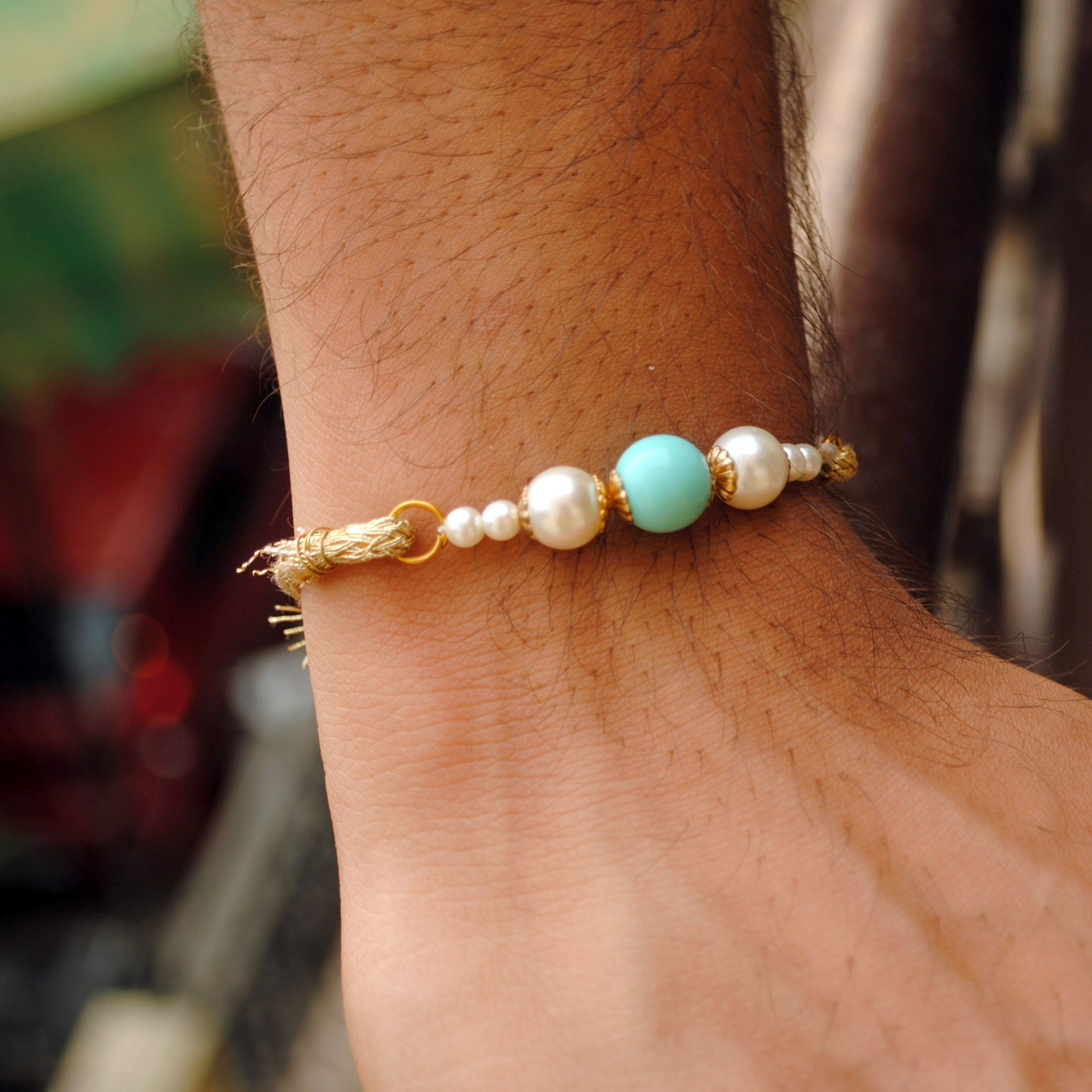 BeAbhika Blue Beads White Pearls Gold Tone Rakhi Special Designer Handmade Unique Bhai Rakhi Available In India Online At Best Price Send Rakhi To Brother COD Available Express Shipping