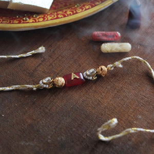 BeAbhika Red Stone Personalised Name Initial Rakhi Customised Name Letter Alphabet Rakhi Lightweight Easy To Tie Rakhi Available At Best Price In India Online COD Available Send Rakhi To Brother Small Brother Big Brother Younger Brother Send Rakhi Abroad With Roli Chawal Capsules Designer Unqiue Famous 