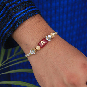 BeAbhika Red Stone Personalised Name Initial Rakhi Customised Name Letter Alphabet Rakhi Lightweight Easy To Tie Rakhi Available At Best Price In India Online COD Available Send Rakhi To Brother Small Brother Big Brother Younger Brother Send Rakhi Abroad With Roli Chawal Capsules Designer Unqiue Famous 