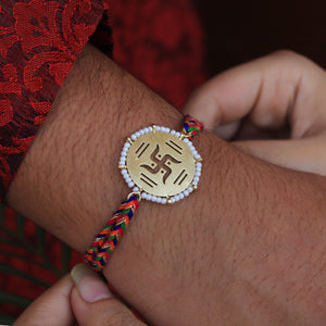 BeAbhika Gold Tone Swathik Design White Beads Religious Swastik Rakhi Designer Unqiue Famous Rakhi Lightweight Easy To Tie Rakhi Available At Best Price In India Online COD Available Send Rakhi To Brother Small Brother Big Brother Younger Brother Send Rakhi Abroad With Roli Chawal Capsules