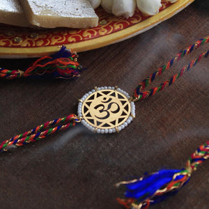 BeAbhika Gold Tone Om Design White Beads Hindu Religious Swastik Rakhi Designer Unqiue Famous Rakhi Lightweight Easy To Tie Rakhi Available At Best Price In India Online COD Available Send Rakhi To Brother Small Brother Big Brother Younger Brother Send Rakhi Abroad With Roli Chawal Capsules