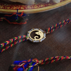 BeAbhika Gold Tone Ganesha Design White Beads Hindu Religious Ganeish Ji Indian God Rakhi Designer Unqiue Famous Rakhi Lightweight Easy To Tie Rakhi Available At Best Price In India Online COD Available Send Rakhi To Brother Small Brother Big Brother Younger Brother Send Rakhi Abroad With Roli Chawal Capsules